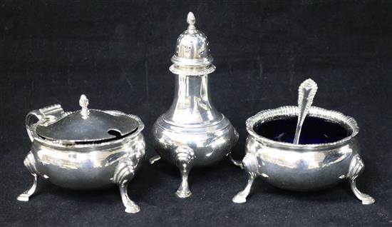 A three piece silver cruet set.